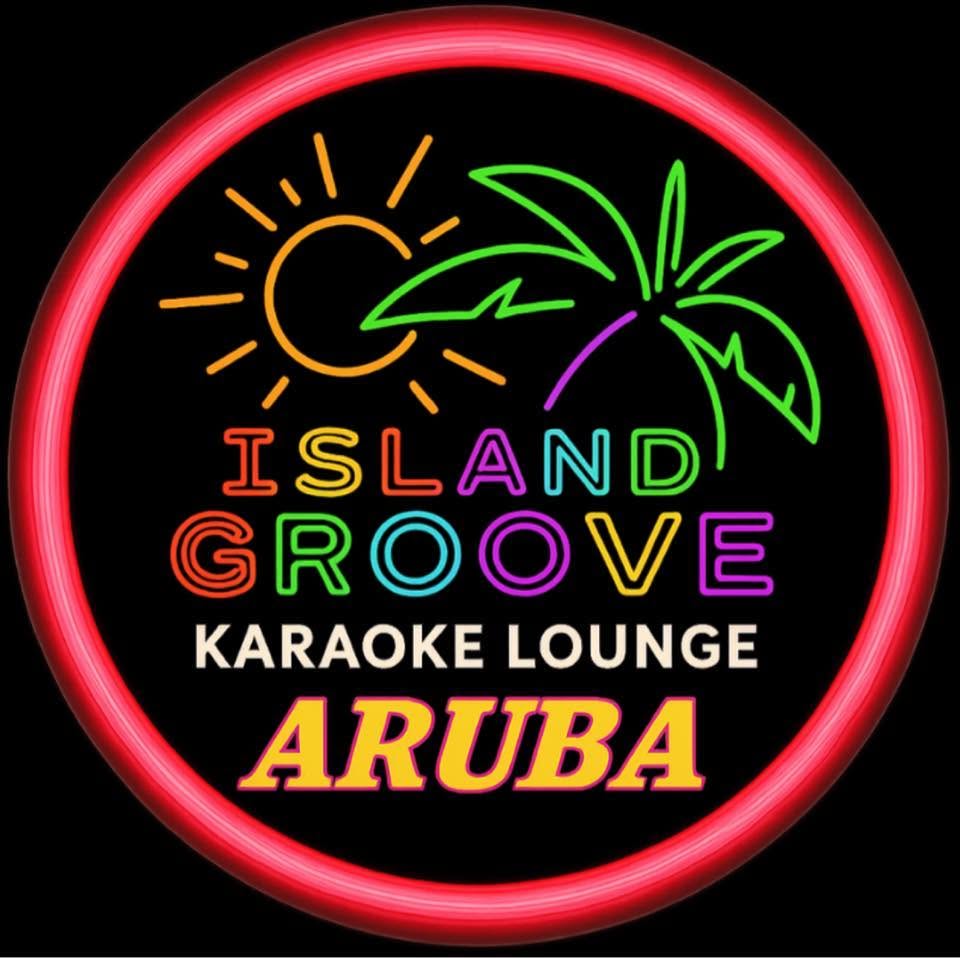 Neon sign logo for Island Groove Karaoke Lounge Aruba featuring a glowing sun, a palm tree, and bright colored lettering within a red circle on a black background.