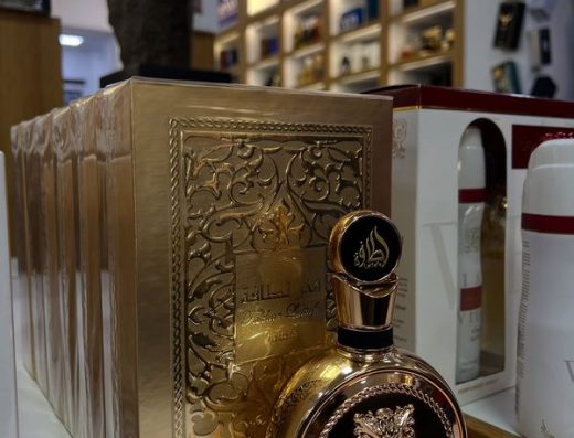 Decorative gold perfume bottle and matching fragrance box displayed inside Dubai Shop Aruba.